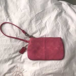 Pink coach clutch